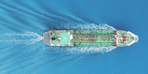 Aerial view shot tanker ship moving on the sea.