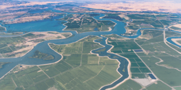 Numerous waterways snake through the delta where the Sacramento River and San Joaquin River meet. Visible in the photo is Bethel Island, Franks Tract State Recreation Area, Mandeville Tip County Park, and Brannan Island State Recreation Area.
