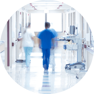 Doctor walking down hospital corridor.
