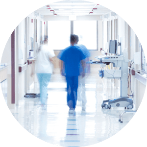 Doctor walking down hospital corridor.