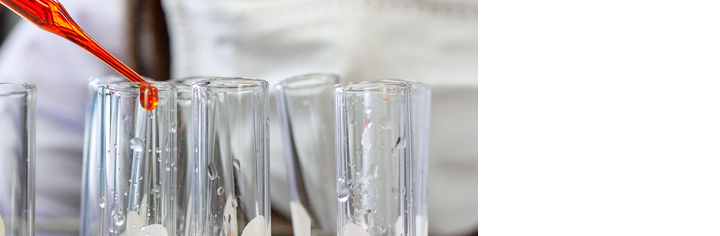 Laboratory concept: Close up picture of scientist use the dropper transfer the chemical reagent in the test tube